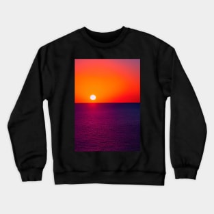 RED AND PURPLE SUNSET OVER THE OCEAN Crewneck Sweatshirt